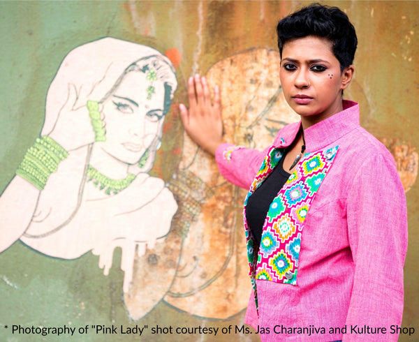 Image of Gowri Jayakumar in MIRCHI KOMACHI Pink Cotton Military Jacket in front of Pink Lady Resists mural