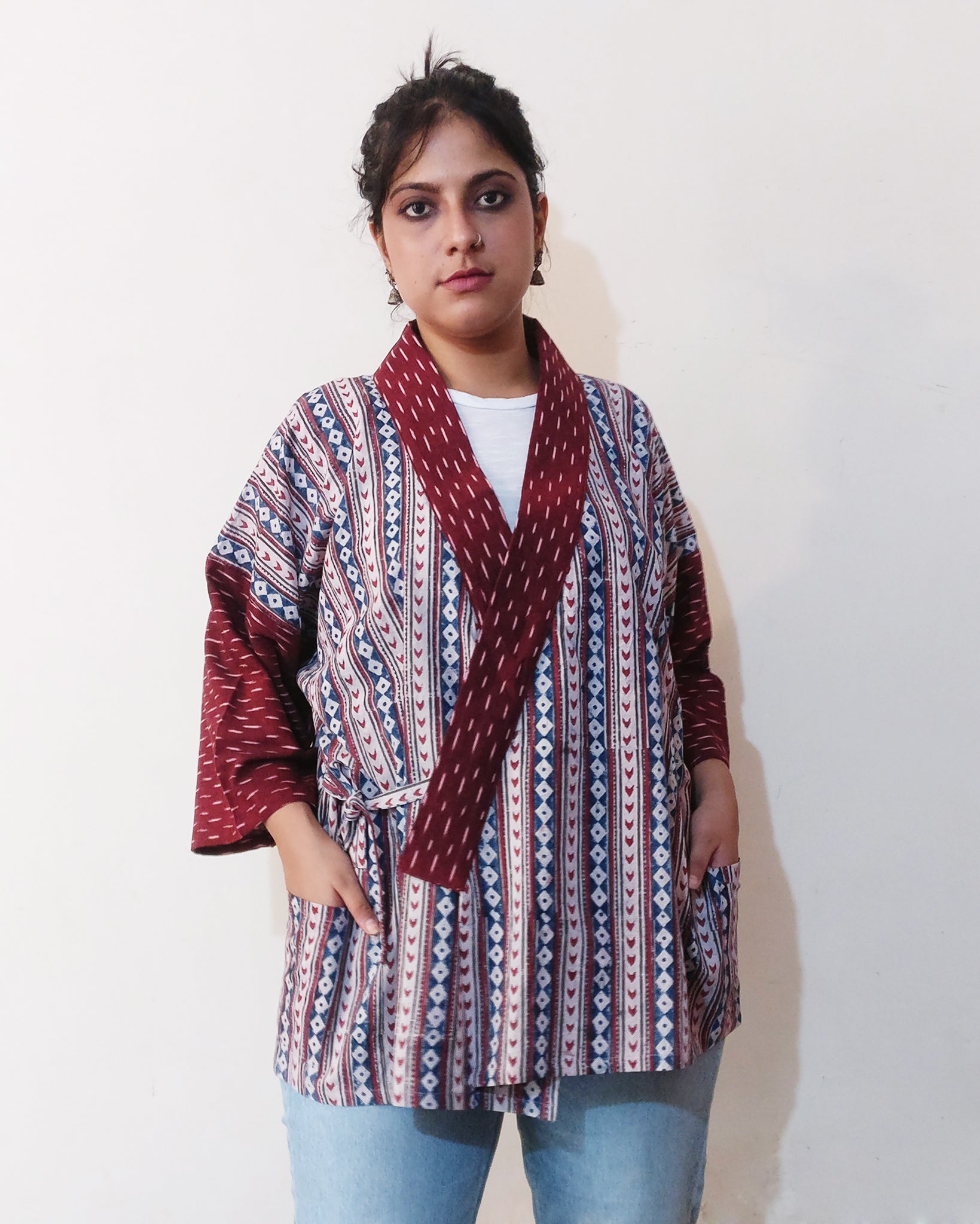 "Jinbei Jacket" is a comfortable adaptation of the casual Kimono, or "Jinbei," typically worn during humid summer in Japan. This Kimono Jacket is made from Indian geometric block print cotton and maroon cotton Ikat. Buy online! Closed