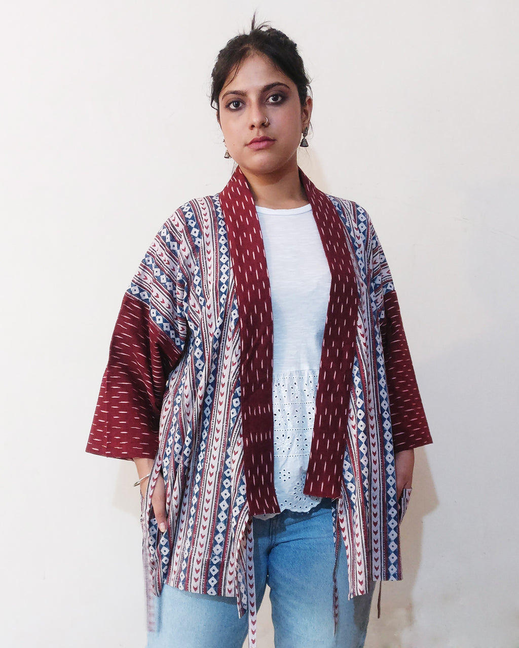 "Jinbei Jacket" is a comfortable adaptation of the casual Kimono, or "Jinbei," typically worn during humid summer in Japan. This Kimono Jacket is made from Indian geometric block print cotton and maroon cotton Ikat. Buy online!