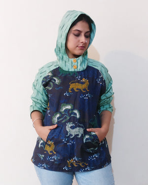 We snagged this adorable Chinese-inspired tiger print because it's a unique find in India and is oddly cute. Teaming it up with Indian ikat, we've made this quirky hoodie! Buy online.