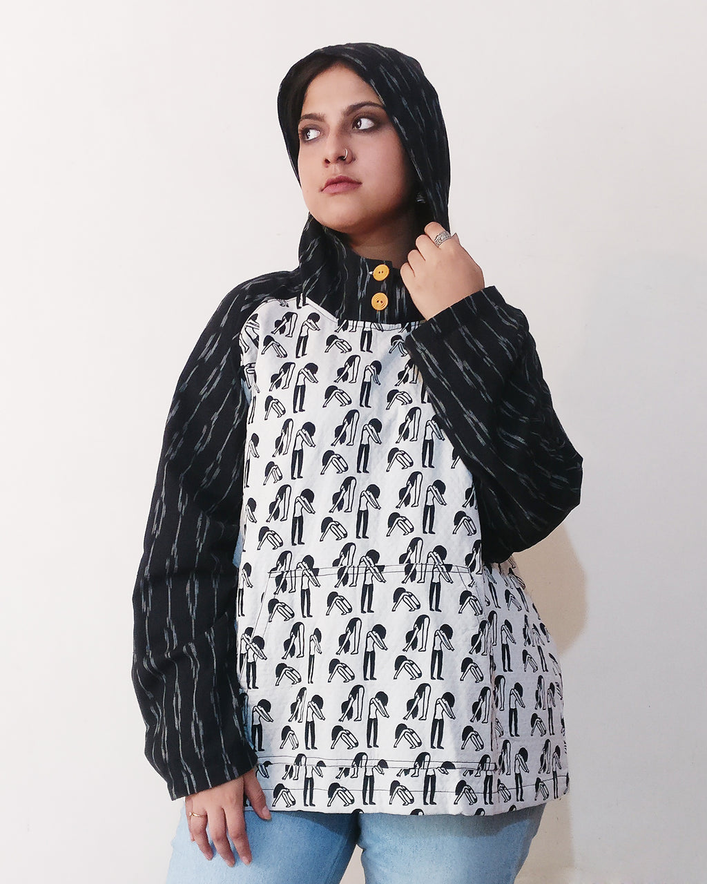 Pairing a quirky print of a exercising woman with a mysterious vibe (quilted and slightly thicker) with ikat, we've created a whimsical hoodie! Buy online.