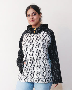Pairing a quirky print of a exercising woman with a mysterious vibe (quilted and slightly thicker) with ikat, we've created a whimsical hoodie! Buy online. Photo without the hood on