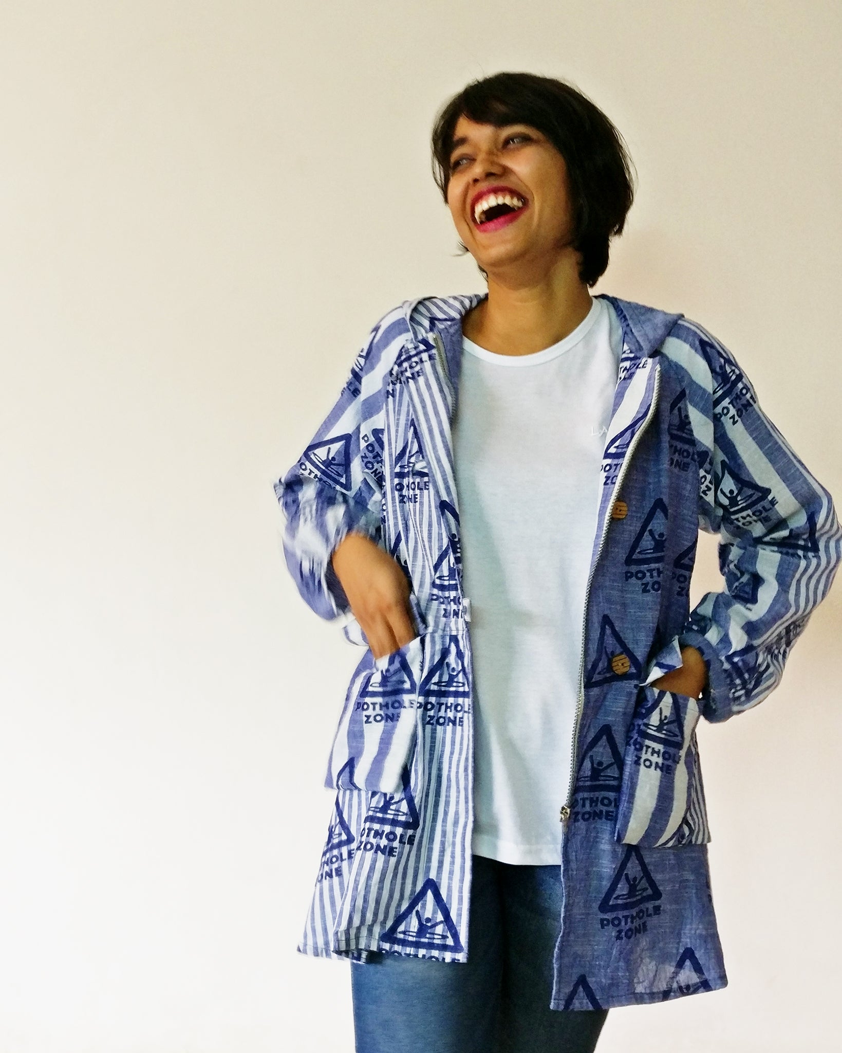Wear your love for Bombay Meri Jaan. Women's parka with our original print Pothole Zone on very cool handloom stripe cotton fabric. Shop online and survive the monsoon!