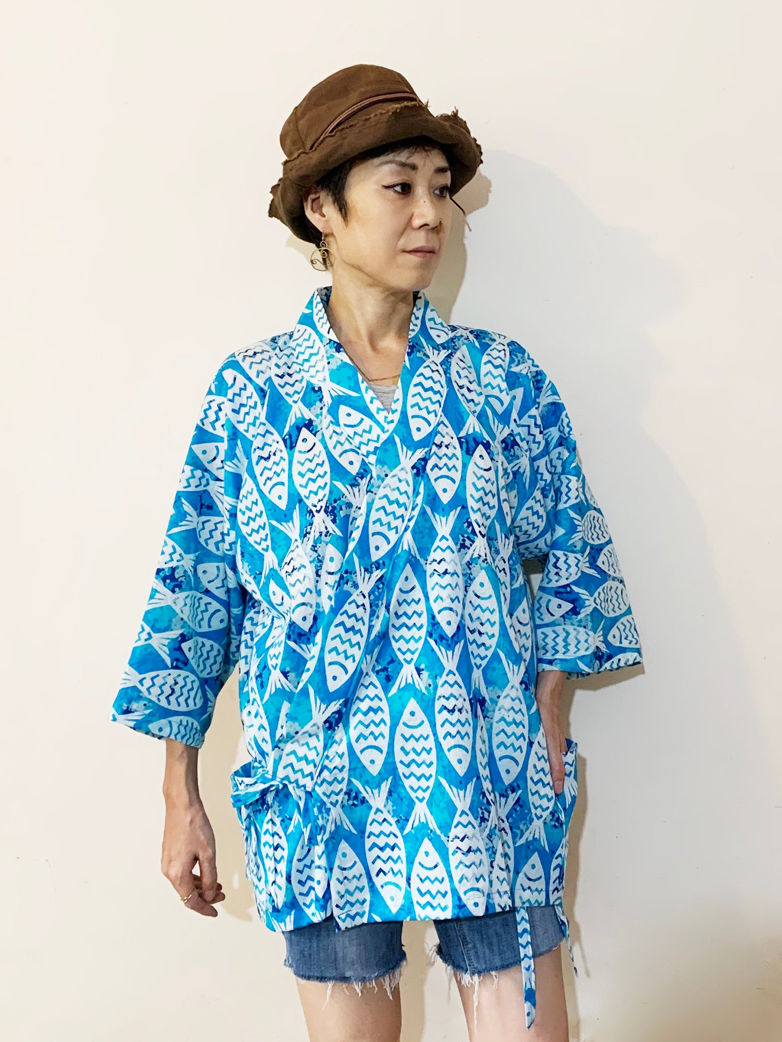 Introducing the first item of Japanese-inspired clothing from MIRCHI KOMACHI - the Jinbei Jacket! Made of breathable cotton and printed with a refreshing ocean fish pattern, this jacket is perfect for staying cool during hot summer days. Pockets? Hell yeah! Shop online.