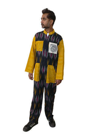 Classic boiler suit (coverall) for daily wear with an Indian traditional fabric, black handloom cotton Ikat and yellow cotton, for all the bodies (unisex) and body types! The oversized silhouette gives cool vibes. If you love jumpsuits, definitely try this! Shop online. - Man model