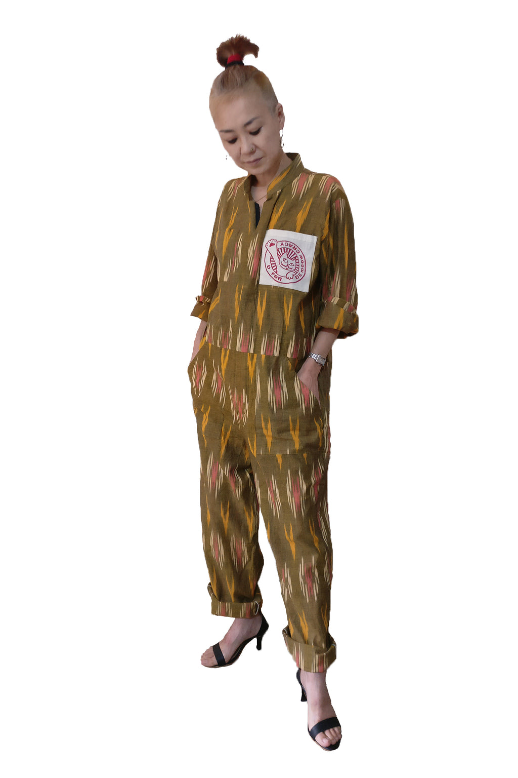 Classic boiler suit (coverall) for daily wear with an Indian traditional fabric, yellow handloom cotton Ikat, for all the bodies (unisex) and body types! The oversized silhouette gives cool vibes. If you love jumpsuits, definitely try this! Shop online. - Woman model